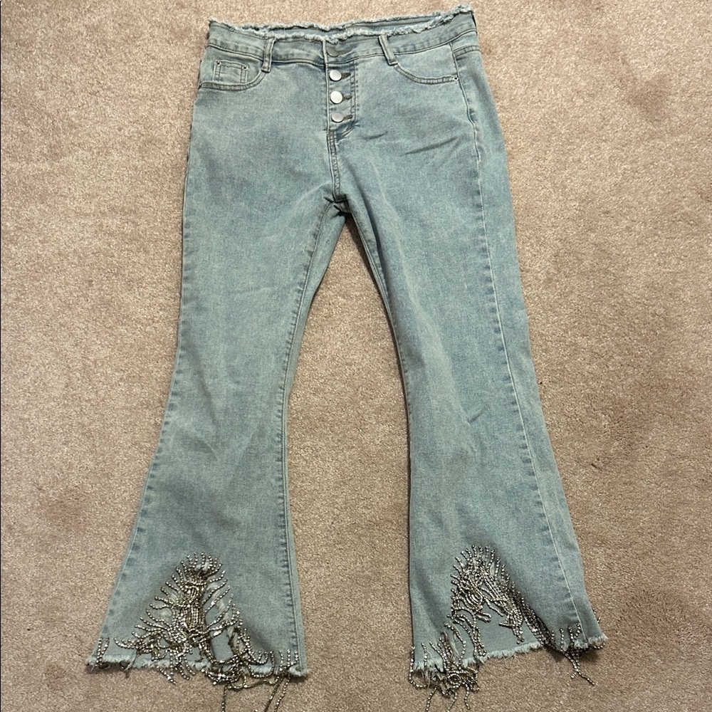 Frayed Hem Flare Jeans in Light Blue with bejeweled bottoms never worn
